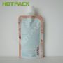 Waterproof reusable laminated plastic facial care pouch with spout